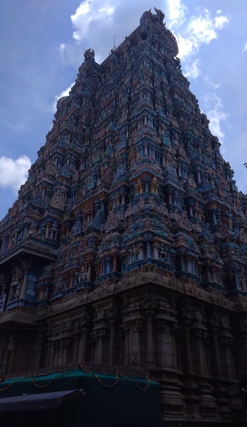 Meenakshi Temple (also referred to as Meenakshi Amman or Meenakshi-Sundareshwara Temple), is a historic Hindu temple located on the southern bank of the Vaigai River in the temple city of Madurai, Tamil Nadu, India. It is dedicated to Meenakshi, a form of Parvati, and her consort, Sundareshwar, a form of Shiva. The temple is at the centre of the ancient temple city of Madurai mentioned in the Tamil Sangam literature, with the goddess temple mentioned in 6th century.