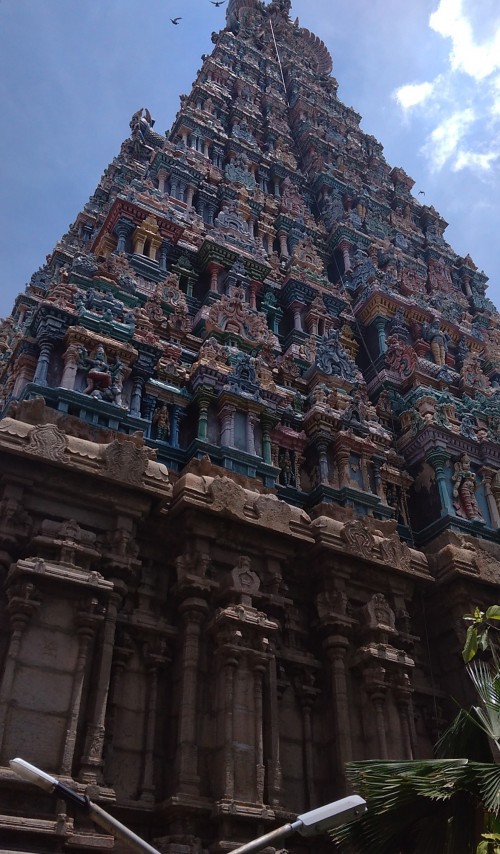 Meenakshi Temple (also referred to as Meenakshi Amman or Meenakshi-Sundareshwara Temple), is a historic Hindu temple located on the southern bank of the Vaigai River in the temple city of Madurai, Tamil Nadu, India. It is dedicated to Meenakshi, a form of Parvati, and her consort, Sundareshwar, a form of Shiva. The temple is at the centre of the ancient temple city of Madurai mentioned in the Tamil Sangam literature, with the goddess temple mentioned in 6th century.