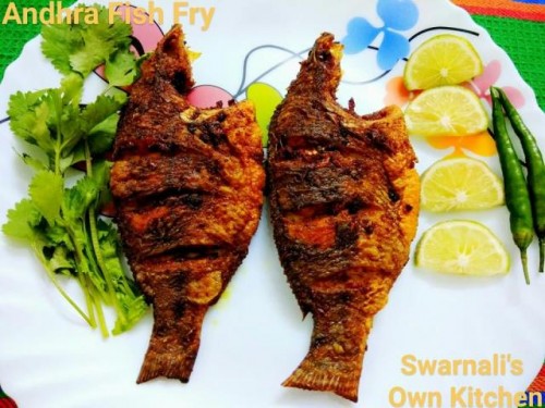 ANDHRA FISH FRY !!!!
Simple and easy to make mouthwatering masala fish fry lemon flavoured.
#andhrapradeshcuisine
#fishfry
#snacksandstarters
#lemonjuice
♥♥♥♥
RECIPE:
INGREDIENTS:
Fish 500 gms
Oil as required for shallow frying
For marinating the fish:
Turmeric powder 1 tsp
Garam masala powder 1 tsp
Kashmiri red chilli powder 2 tbsp
Ginger garlic paste 1 & 1/2 tbsp
Lemon juice 1/4 cup
Salt to taste
Coriander leaves + lemon wedges + green chillies as required to garnish

PROCESS:
Cut, clean, wash, drain and pat dry the fishes nicely.
Make 3 slashes on the both sides of the fishes, keep aside.
Now mix all the ingredients nicely except fish and oil to make a small paste.
Now, take each fish and coat nicely with this marinade and keep aside for about 30 minutes.
Heat oil in a non stick pan or a tawa.
Now pan fry the fishes, till both sides of the fishes turns golden.
Drain in an absorbent kitchen towel to absorb the excess oil and keep aside.
Fry in batches.
Arrange them in a dish.
Garnish with coriander leaves, lemon wedges and green chillies.
Serve hot as a snacks or starters.
Or it can be served hot with white steamed rice, dal and vegetables.
ENJOY !!!!
♥♥♥