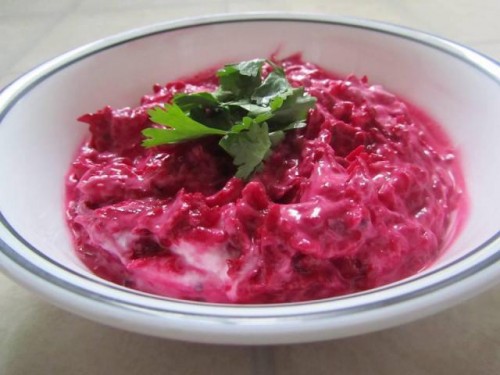 Recipe By Supritee

Beetroot carrot raita

Take 2 cups curd ...
1 medium size beetroot grated...
1 medium size carrot grated....
1 onion finely chopped.....
1 small capsicum finely chopped......
1 tsp cumin seed powder ......
rock salt or black salt to taste....
smoothen the curd.....
add all the chopped veggies to it along with the cumin seed powder and salt..... mix well.
garnish it with coriander leaves....
serve the raita with pulao, biryani or with dal and rice......