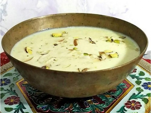 Recipe By supritee

Kheer....
Ingredients :-

1 ltr milk, full cream....
1/4 cup sama ke chawal, washed...
1/2 cup sugar...
10-12 kishmish.....
4 chhoti elaichi......1
0-12 almonds.....
blanched and shredded....

Preparations: -
Put rice and milk in a deep pan and bring to boil.....Simmer over low heat.... stirring a few times till the rice is cooked and milk has thickened. (Takes about 25 minutes)....When cooked, add sugar, kishmish and elaichi.....Stir till sugar is dissolved and 10-15 minutes after that.....transfer on to a serving dish, garnish with the almonds.....

Serve hot or chilled.