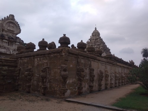 The Kanchi Kailasanathar temple is the oldest structure in Kanchipuram. Located in Tamil Nadu, India, it is a Hindu temple in the Tamil architectural style. It is dedicated to the Lord Shiva, and is known for its historical importance. The temple was built from 685-705CE by a Rajasimha (Narasimhavarman II) ruler of the Pallava Dynasty. The low-slung sandstone compound contains a large number of carvings, including many half-animal deities which were popular during the early Pallava architectural period. The structure contains 58 small shrines which are dedicated to various forms of Shiva. These are built into niches on the inner face of the high compound wall of the circumambulatory passage.