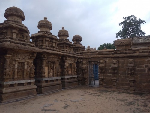 The Kanchi Kailasanathar temple is the oldest structure in Kanchipuram. Located in Tamil Nadu, India, it is a Hindu temple in the Tamil architectural style. It is dedicated to the Lord Shiva, and is known for its historical importance. The temple was built from 685-705CE by a Rajasimha (Narasimhavarman II) ruler of the Pallava Dynasty. The low-slung sandstone compound contains a large number of carvings, including many half-animal deities which were popular during the early Pallava architectural period. The structure contains 58 small shrines which are dedicated to various forms of Shiva. These are built into niches on the inner face of the high compound wall of the circumambulatory passage.