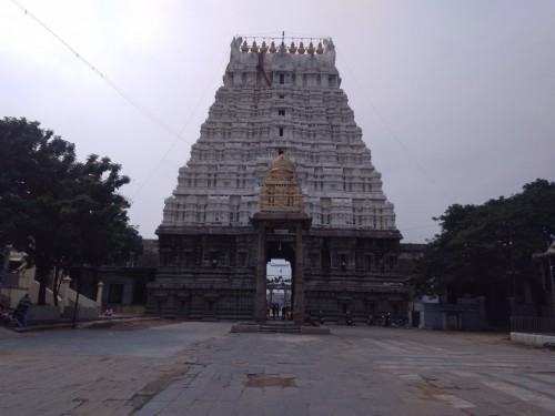 Varadharaja Perumal Temple or Hastagiri or Attiyuran is a Hindu temple dedicated to Lord Vishnu located in the holy city of Kanchipuram, Tamil Nadu, India. It is one of the Divya Desams, the 108 temples of Vishnu believed to have been visited by the 12 poet saints, or Alwars. It is located in a suburb of Kanchipuram known as the Vishnu Kanchi that is a home for many famous Vishnu temples. One of the greatest Hindu scholars of Vaishnava Vishishtadvaita philosophy, Ramanuja is believed to have resided in this temple. The temple along with Ekambareswarar Temple and Kamakshi Amman Temple in Kanchipuram is popularly known as Mumurtivasam (abode of trio), while Srirangam is referred to as: ‘Koil’ (meaning: "temple") and Tirupati as:‘Malai’ (Meaning: "hill").