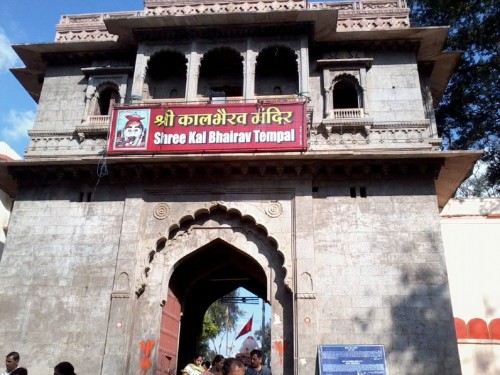 The Kal Bhairav temple is a Hindu temple located in the Ujjain city of Madhya Pradesh, India. It is dedicated to Kal Bhairav, the guardian deity of the city. Located on the banks of the Shipra River, it is one of the most active temples in the city, visited by hundreds of devotees daily. Liquor is one of the offerings made to the temple deity.