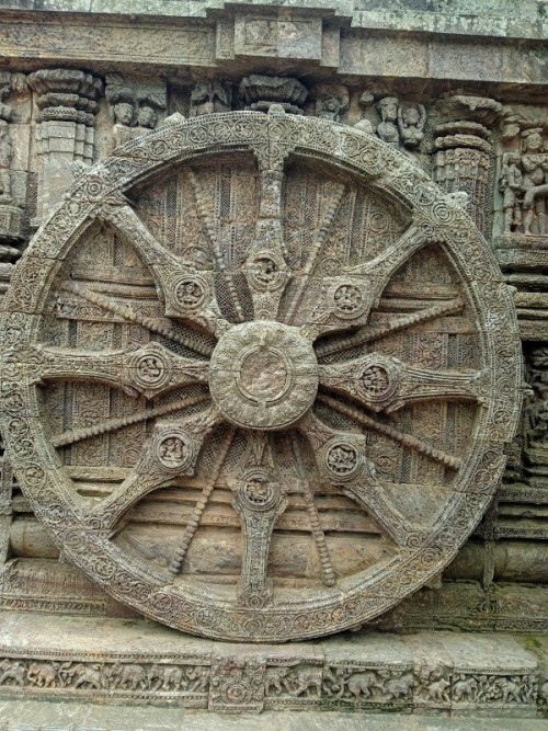 The entire temple is made in the form of a huge chariot of Sun God with 24 wheels (12 pairs). The Konark wheel is the primary attraction of the temple. The wheels of the chariot have exquisitely decorated around their axles and peripheries. The art work of every wheel is different. The wheels of the chariot are also symbolic and have been interpreted as the 'Sun Dial'.
The 12 pairs of wheels symbolize 12 months of a year each wheel has eight spokes in it.